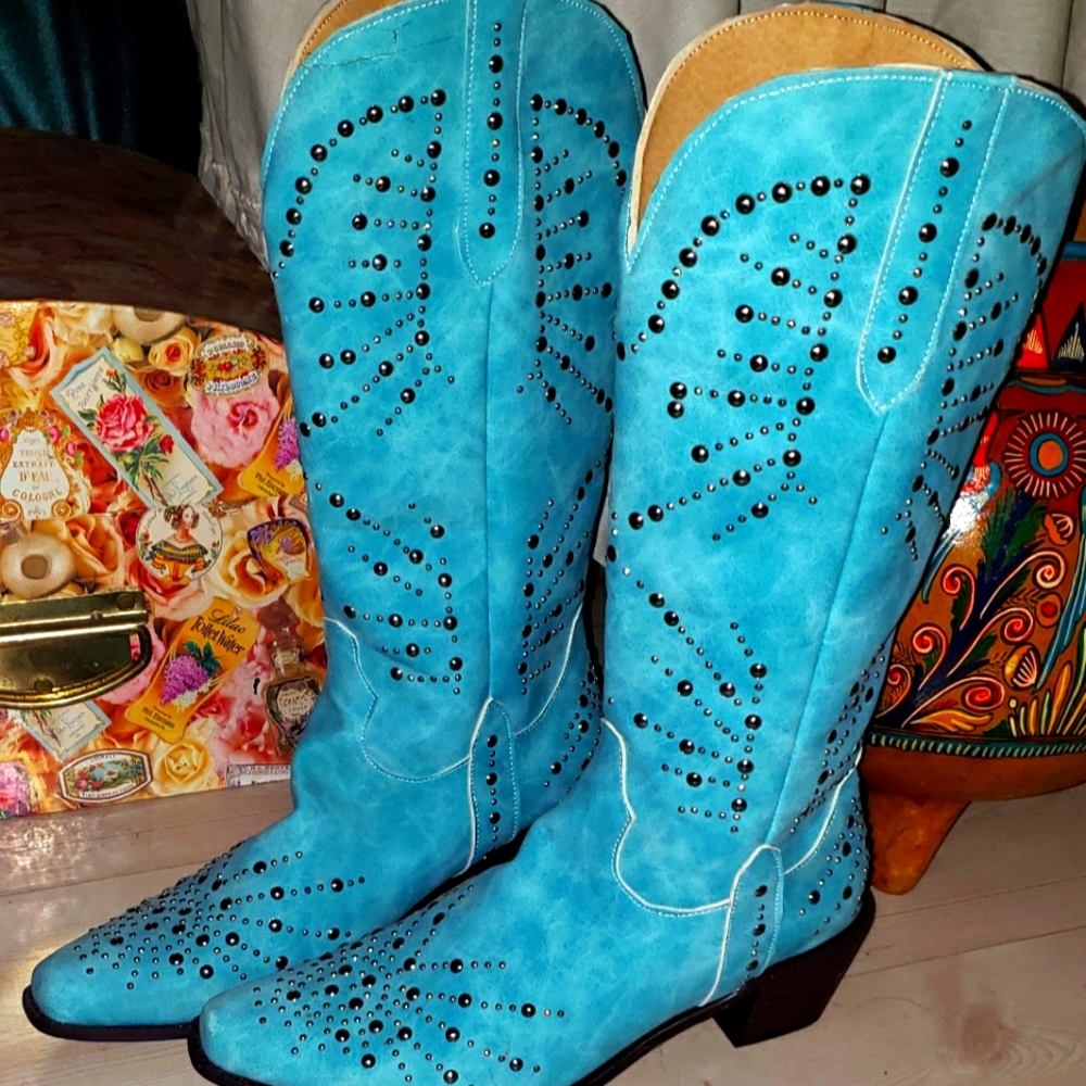 Turquoise siver studded women's cowboy boots.
